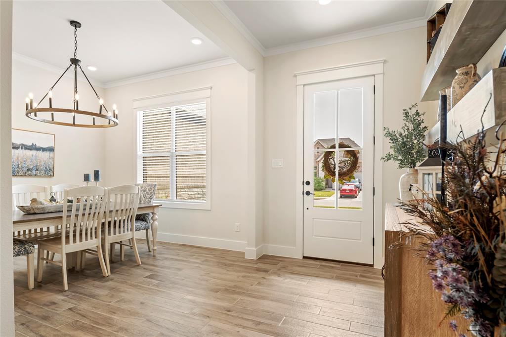 704 Abbey Road Van Alstyne, TX 75495 - Photo 4 of 38 a view of a dining room with furniture window and wooden floor
