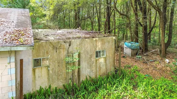 a view of a backyard of the house