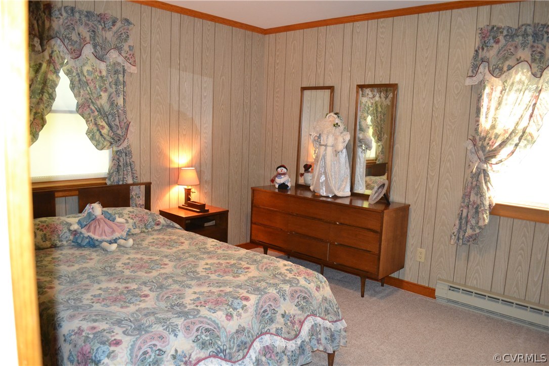 9711 Beaver Bridge Road Chesterfield, VA 23838 - Photo 21 of 24 a bedroom with a bed and large windows