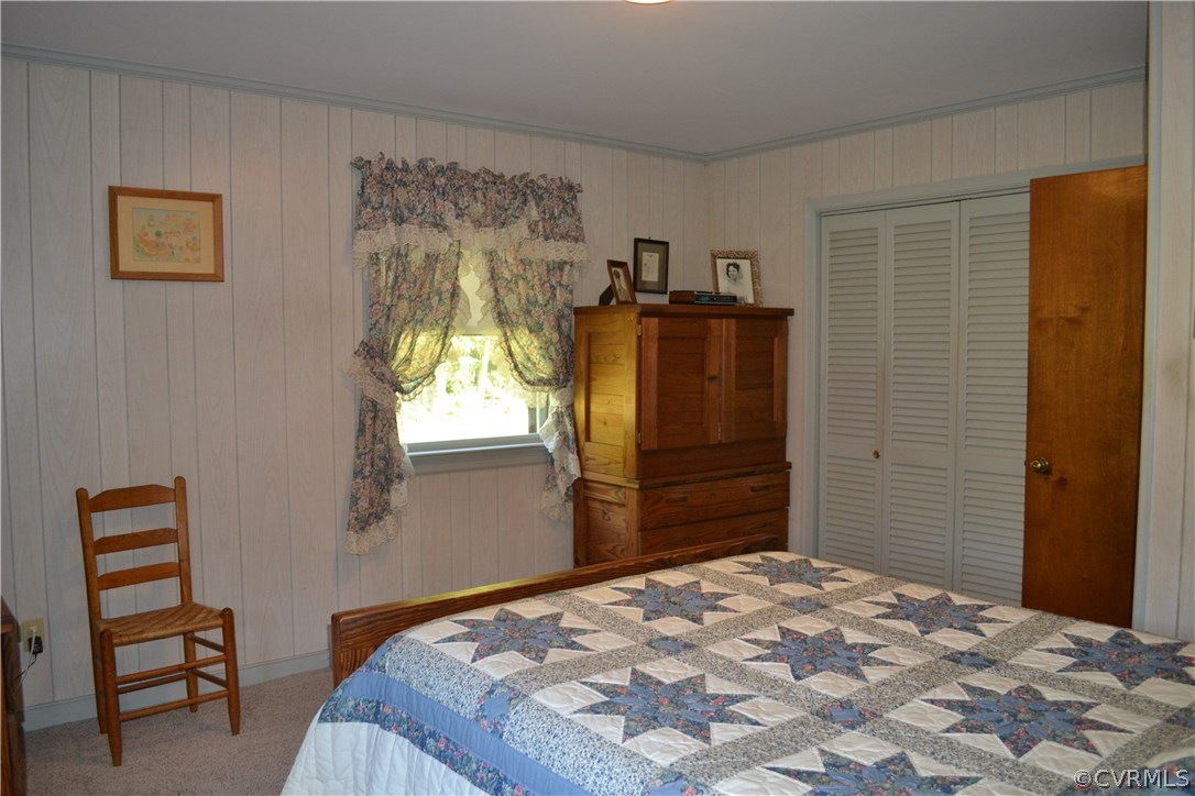 9711 Beaver Bridge Road Chesterfield, VA 23838 - Photo 22 of 24 a bedroom with a bed and a closet