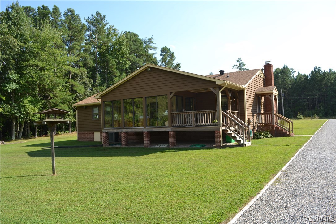 9711 Beaver Bridge Road Chesterfield, VA 23838 - Photo 3 of 24 a view of a house with a yard and a garden