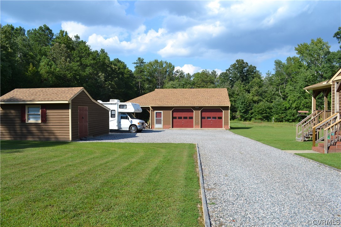 9711 Beaver Bridge Road Chesterfield, VA 23838 - Photo 4 of 24 a front view of a house with yard patio and green space