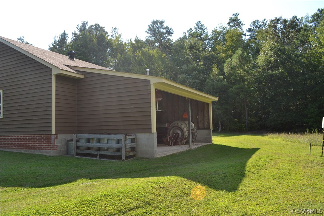9711 Beaver Bridge Road Chesterfield, VA 23838 - Photo 7 of 24 a view of a backyard with plants and a garden