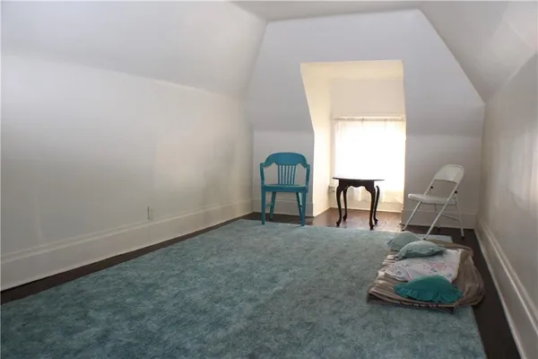 a room with window and a chair