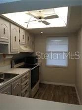 a kitchen with stainless steel appliances granite countertop a sink and a stove