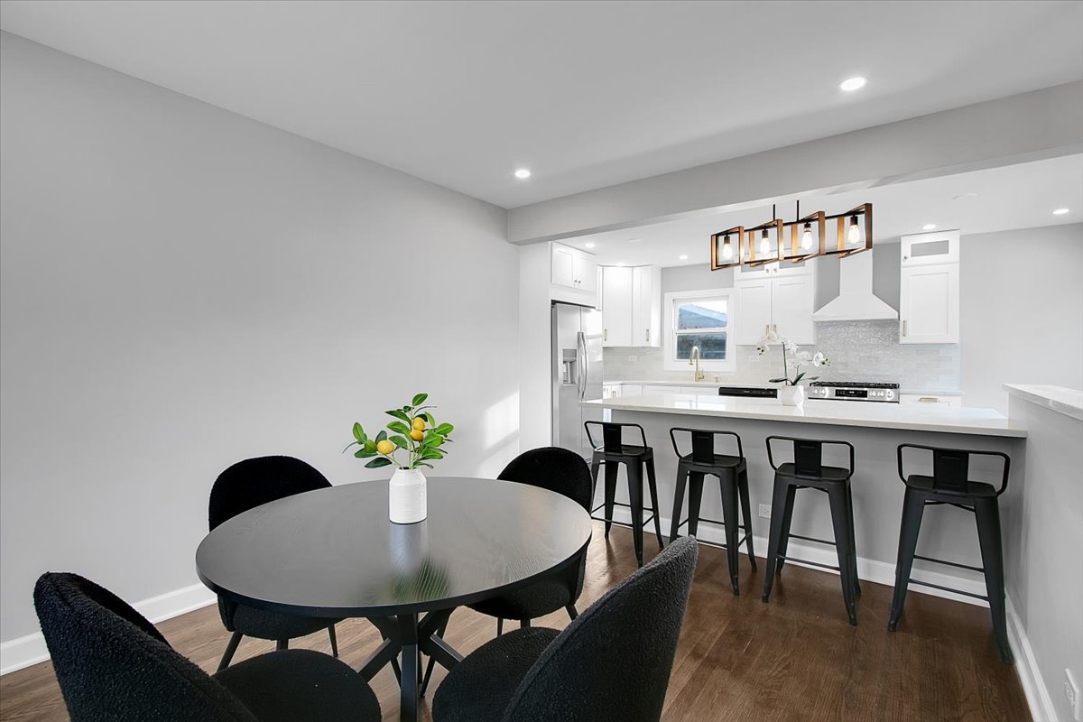 11524 South Kildare Avenue Alsip, IL 60803 - Photo 19 of 34 a dining room with furniture and wooden floor