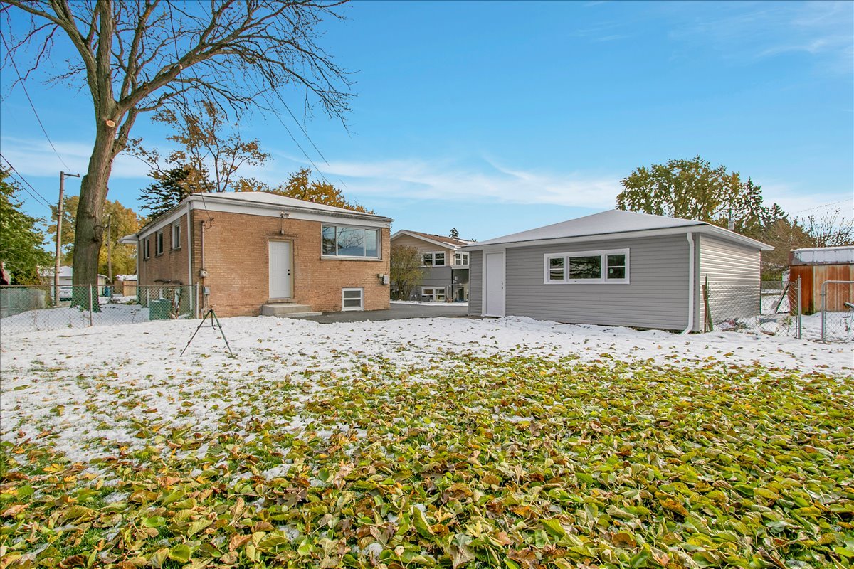 11524 South Kildare Avenue Alsip, IL 60803 - Photo 34 of 34 a front view of a house with a yard