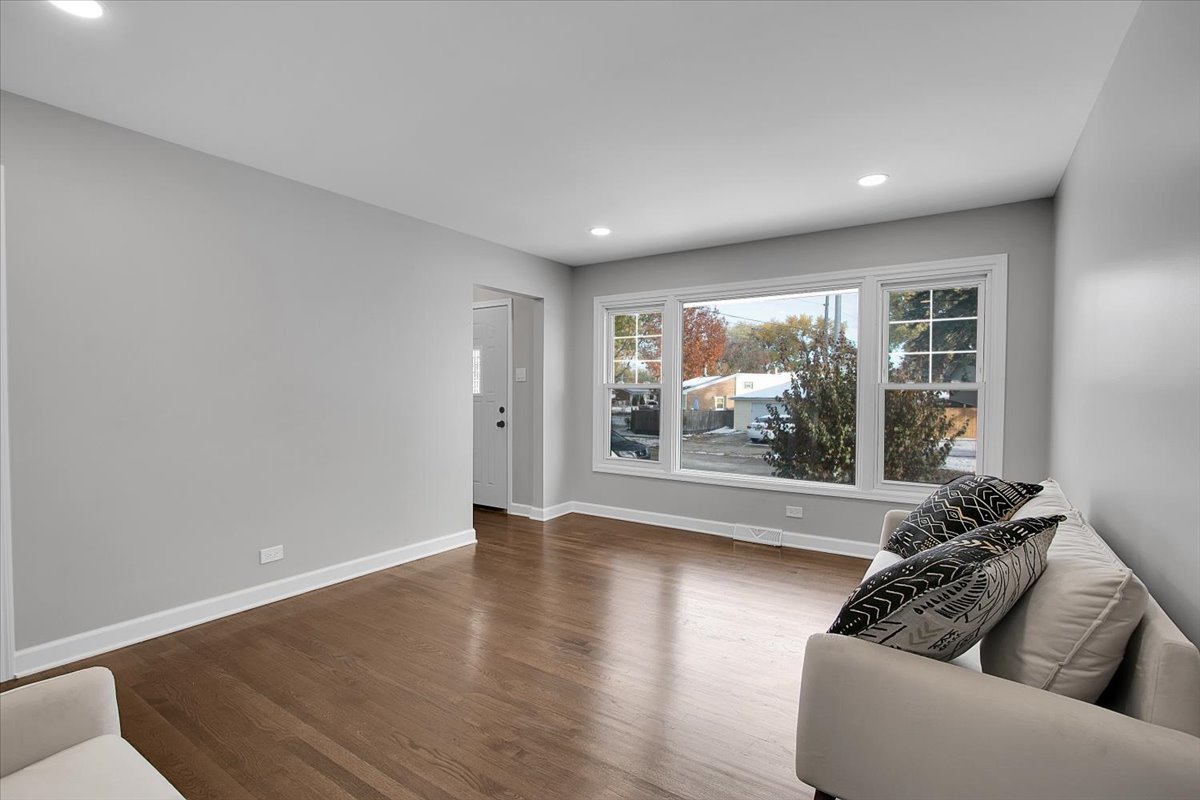 11524 South Kildare Avenue Alsip, IL 60803 - Photo 5 of 34 a living room with furniture and a large window