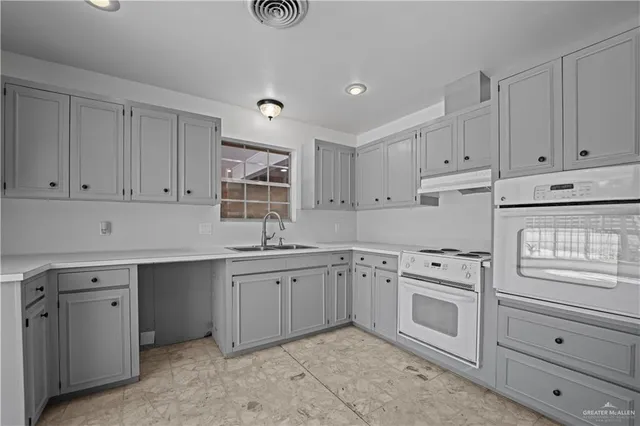 a view of a livingroom with a fireplace and window