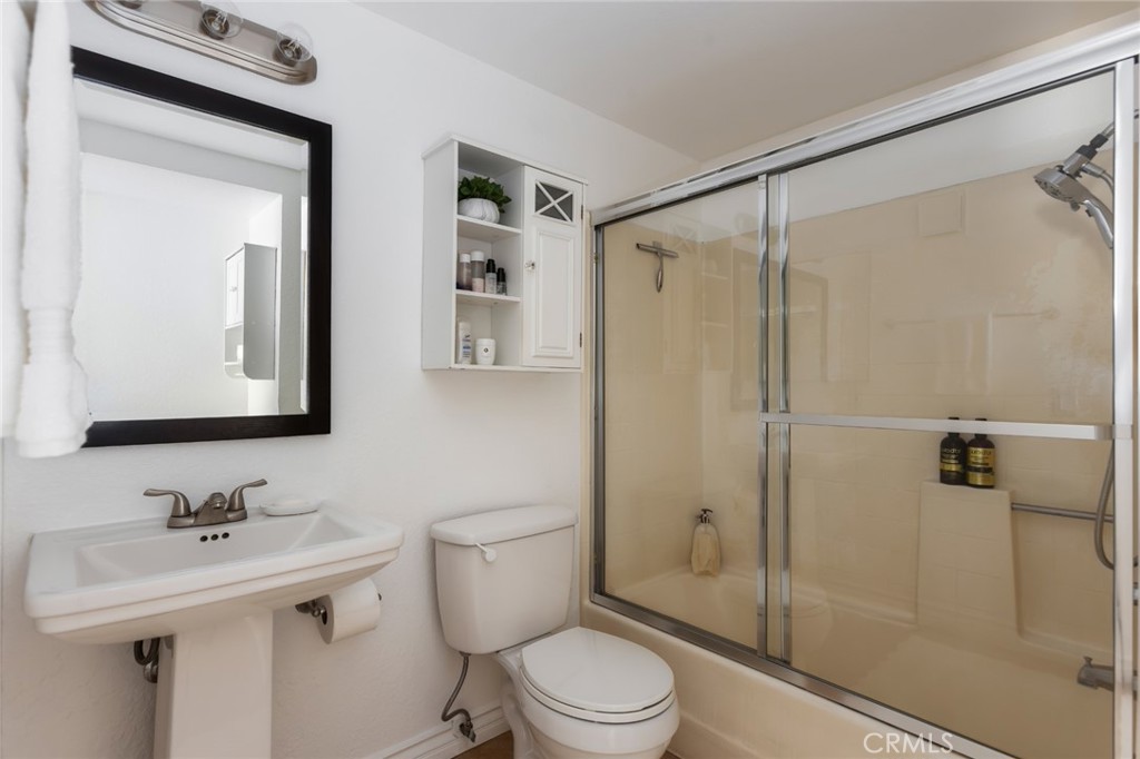 726 Elm Avenue, Unit 404 Long Beach, CA 90813 - Photo 27 of 31 a bathroom with a sink toilet and shower