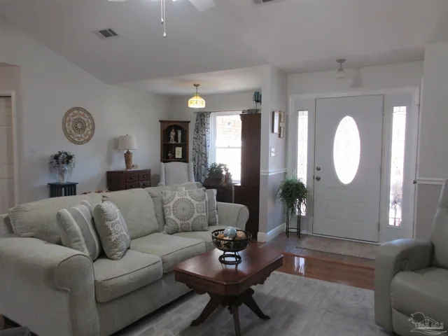 a living room with furniture and a window