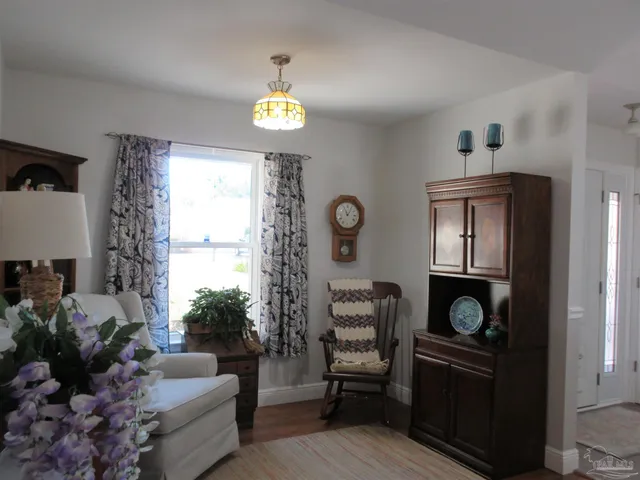 a living room with furniture and a window