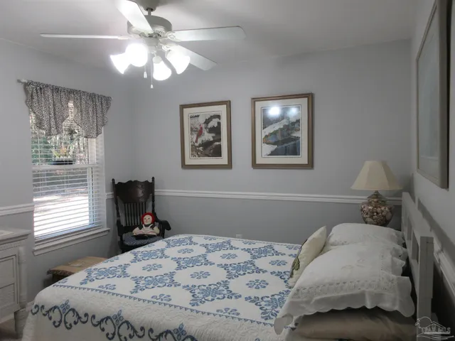 a view of a house with a small yard and plants