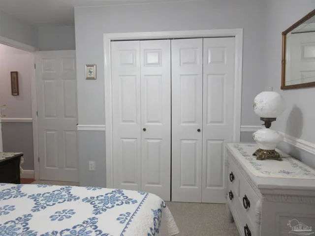 a backyard of a house with lots of trees