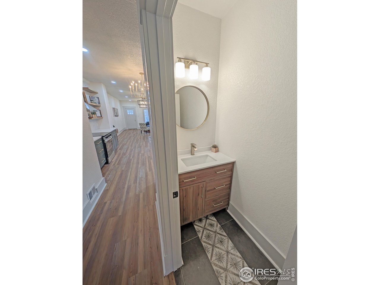 710 Carson Street Brush, CO 80723 - Photo 18 of 31 a bathroom with a sink and a mirror
