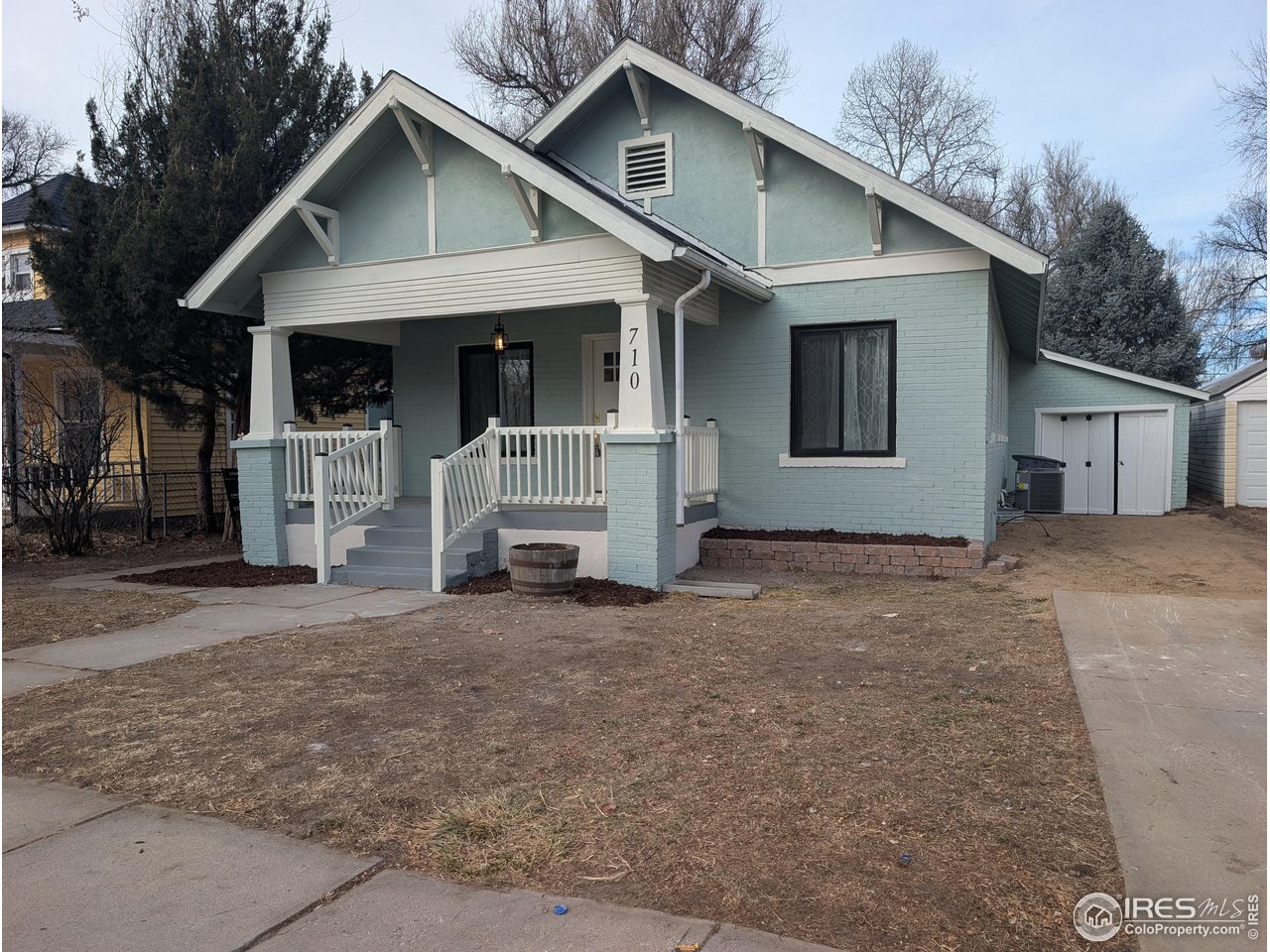 710 Carson Street Brush, CO 80723 - Photo 2 of 31 a view of a house with a yard and large tree