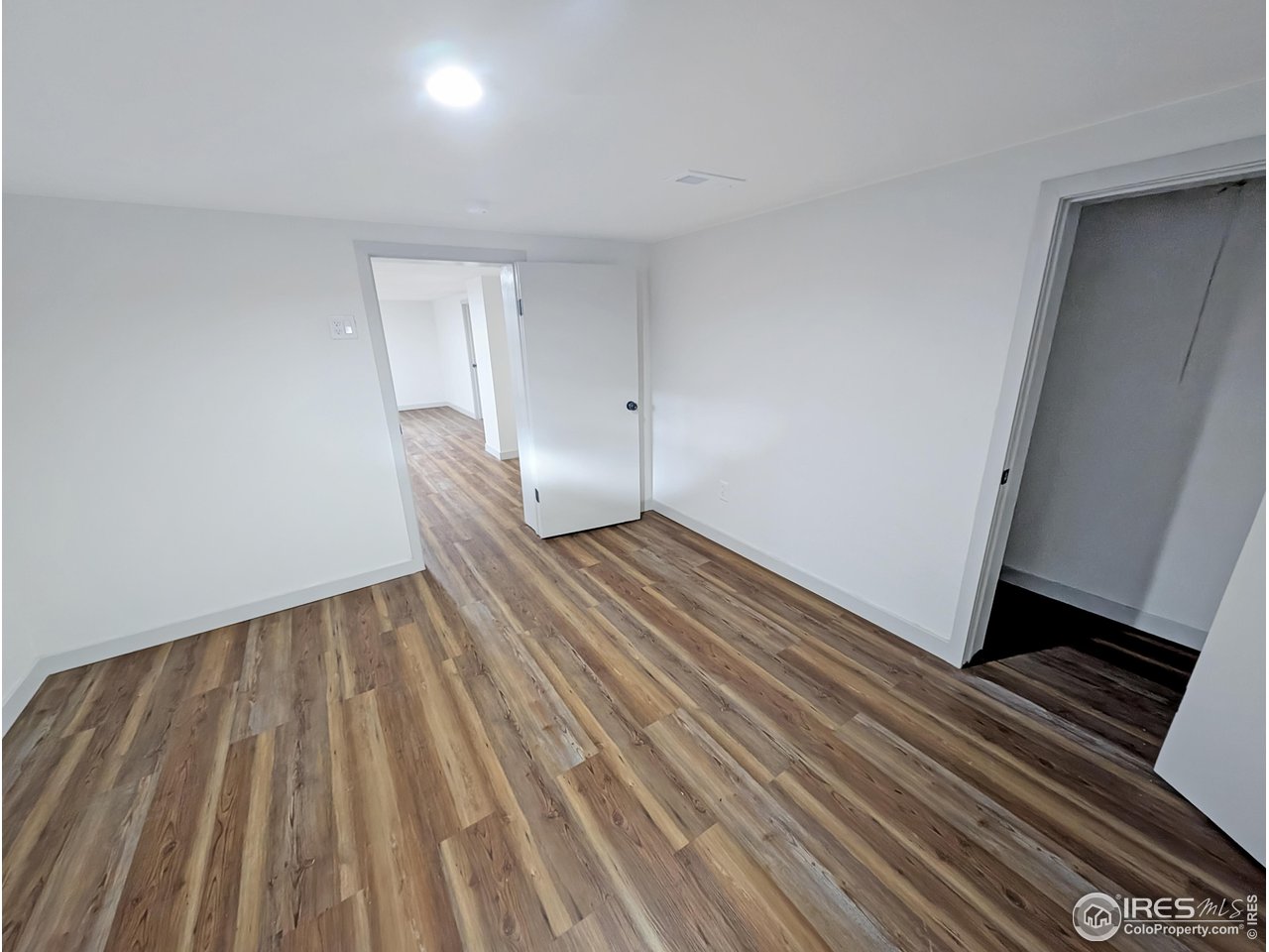 710 Carson Street Brush, CO 80723 - Photo 23 of 31 a view of wooden floor in an empty room