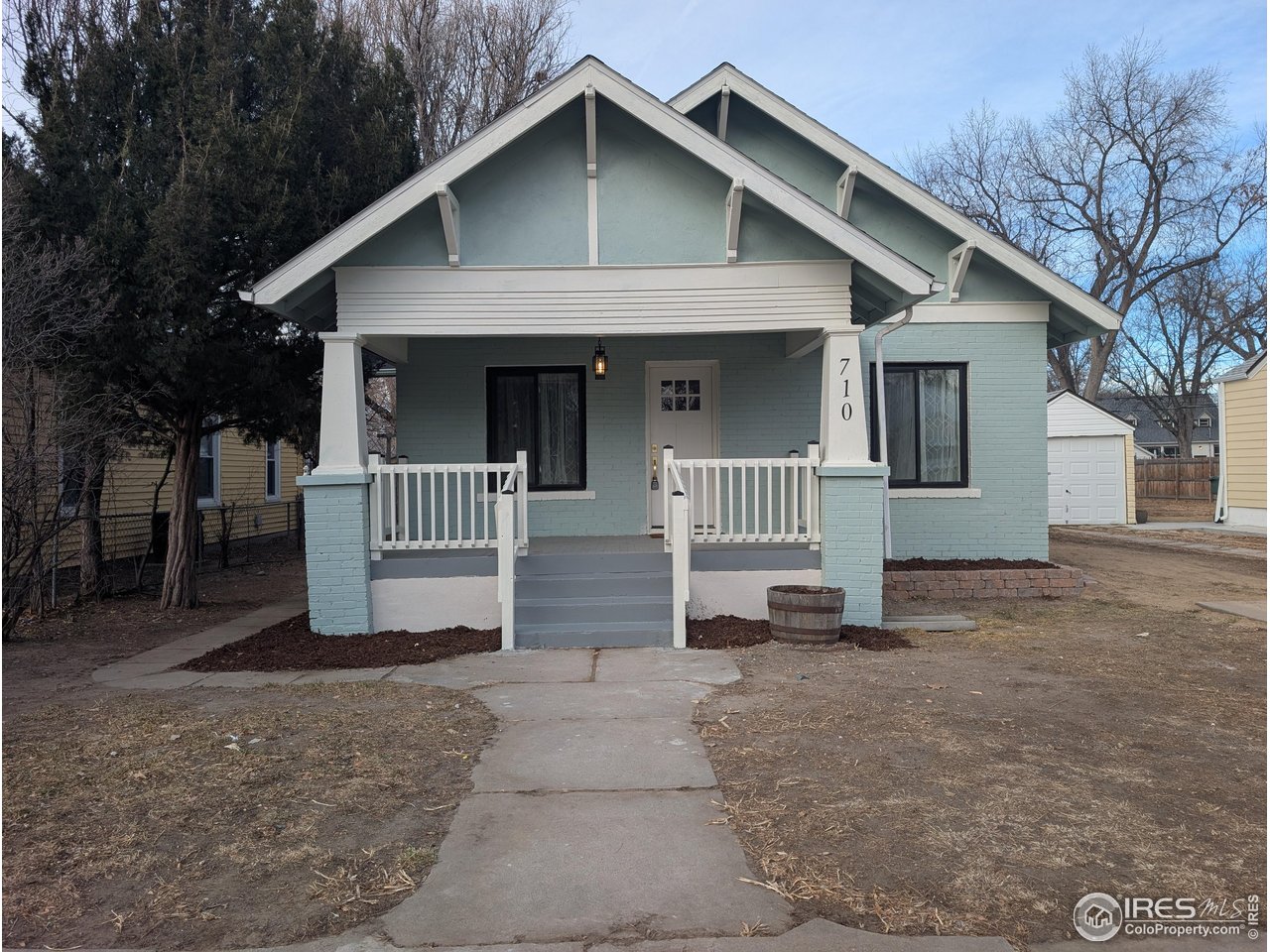 710 Carson Street Brush, CO 80723 - Photo 26 of 31 a front view of a house with a yard