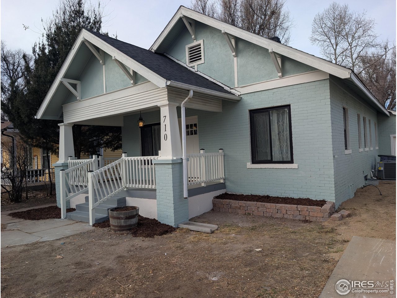 710 Carson Street Brush, CO 80723 - Photo 27 of 31 a view of a house with a small yard and wooden fence