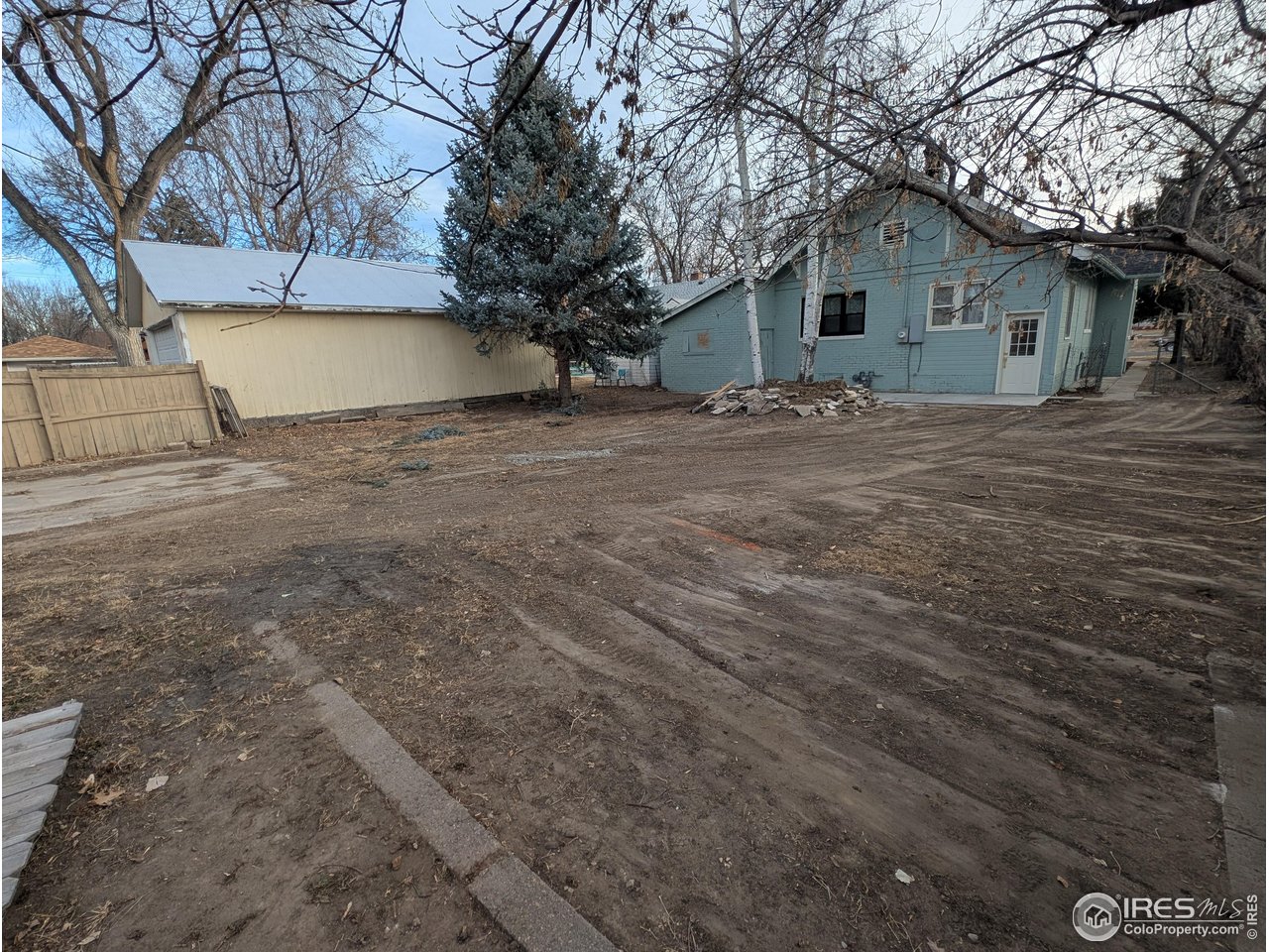 710 Carson Street Brush, CO 80723 - Photo 30 of 31 a view of a house with a yard