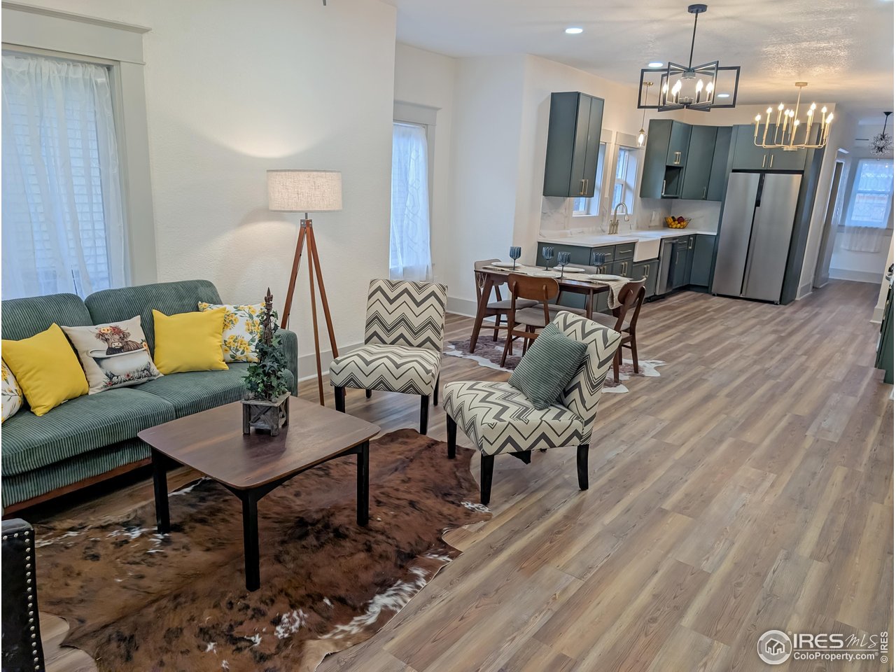 710 Carson Street Brush, CO 80723 - Photo 6 of 31 a living room with furniture and a chandelier