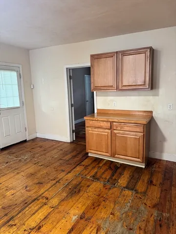 a kitchen with a stove and a refrigerator