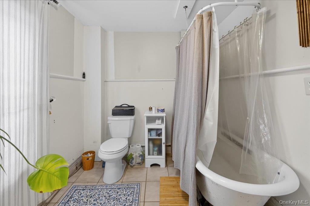 792 Springtown Road Rosendale, NY 12486 - Photo 13 of 45 Full bathroom featuring light tile patterned floors and shower / bath combo