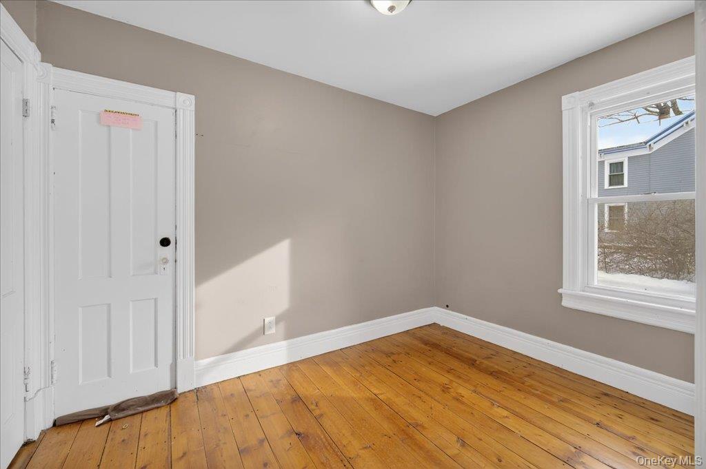 792 Springtown Road Rosendale, NY 12486 - Photo 41 of 45 Unfurnished room with baseboards and hardwood / wood-style flooring