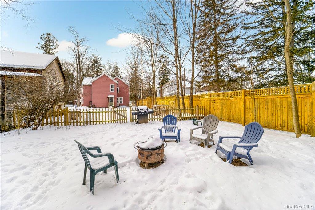 792 Springtown Road Rosendale, NY 12486 - Photo 43 of 45 Snow covered patio with a fenced backyard, area for grilling, and an outdoor fire pit