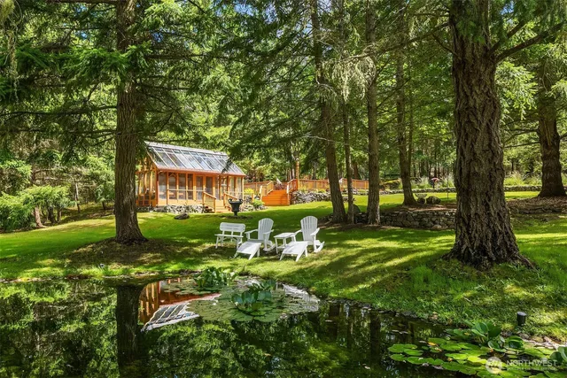 a view of an house with backyard space and garden