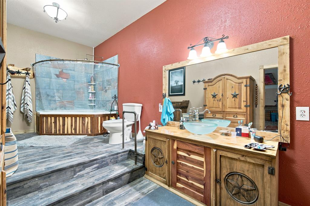 5821 Waterworks Road Midlothian, TX 76065 - Photo 13 of 36 Primary bath features custom cabinets and trim.
