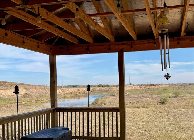 a view of an empty room with windows
