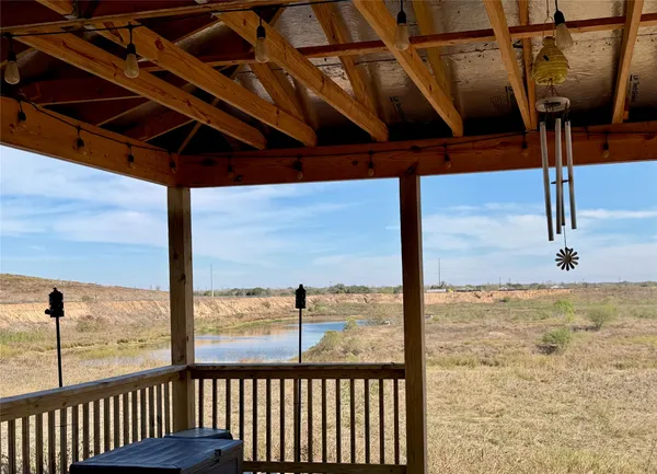 a view of an empty room with windows