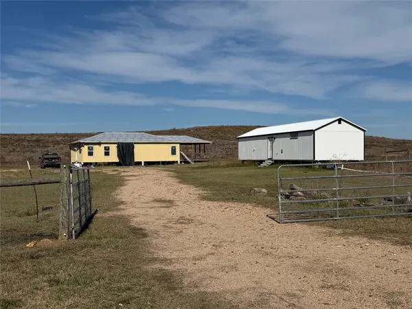 a view of a back yard of the house