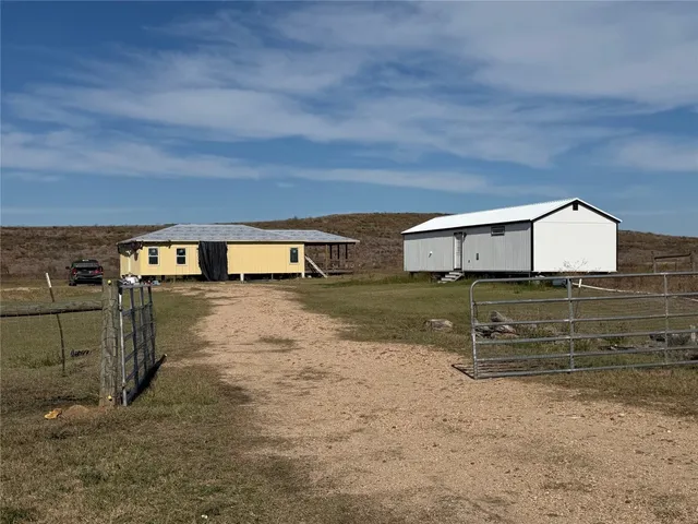 a view of a back yard of the house