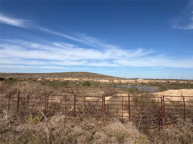 a view of a lake in middle of forest