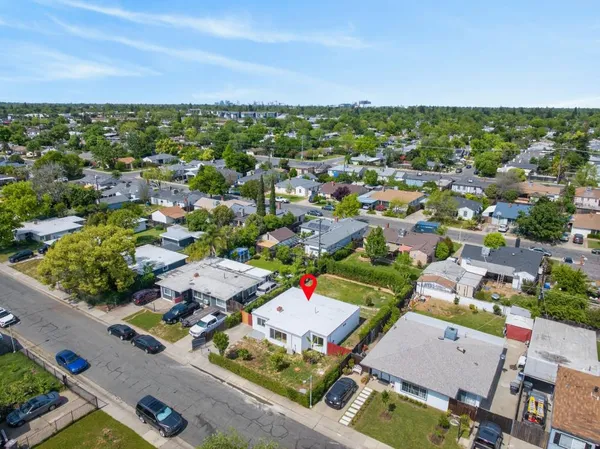 an aerial view of residential houses with outdoor space