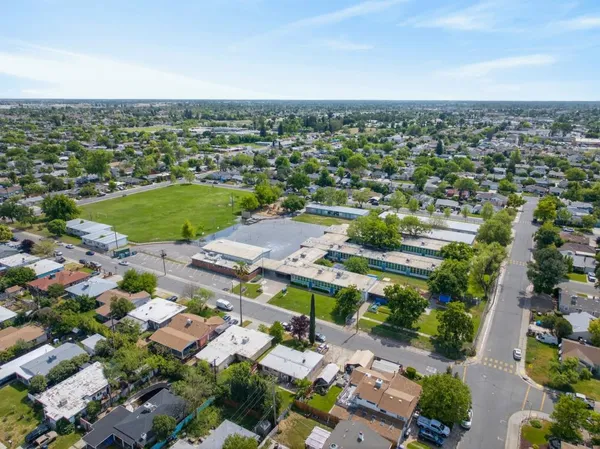 an aerial view of residential houses with outdoor space