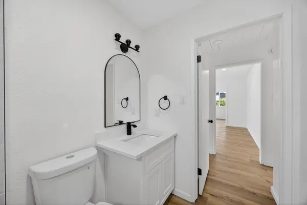 a bathroom with a sink and toilet