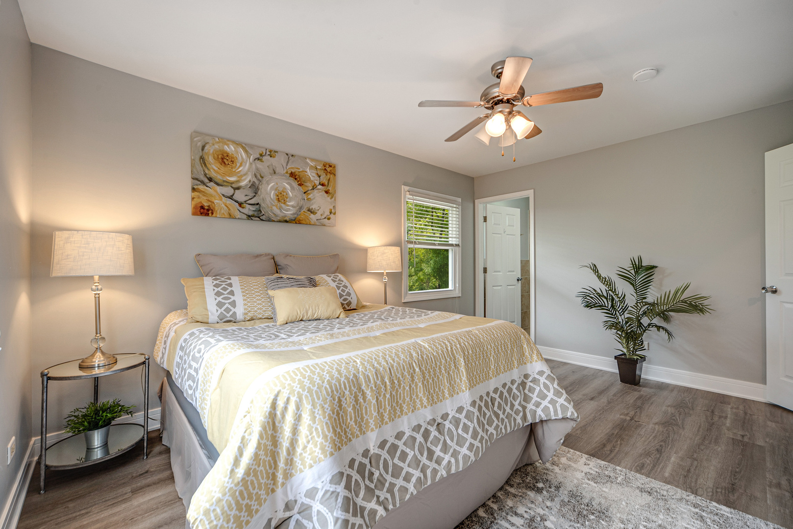 110 Haman Road Inverness, IL 60010 - Photo 13 of 30 a bedroom with a large bed and a chandelier