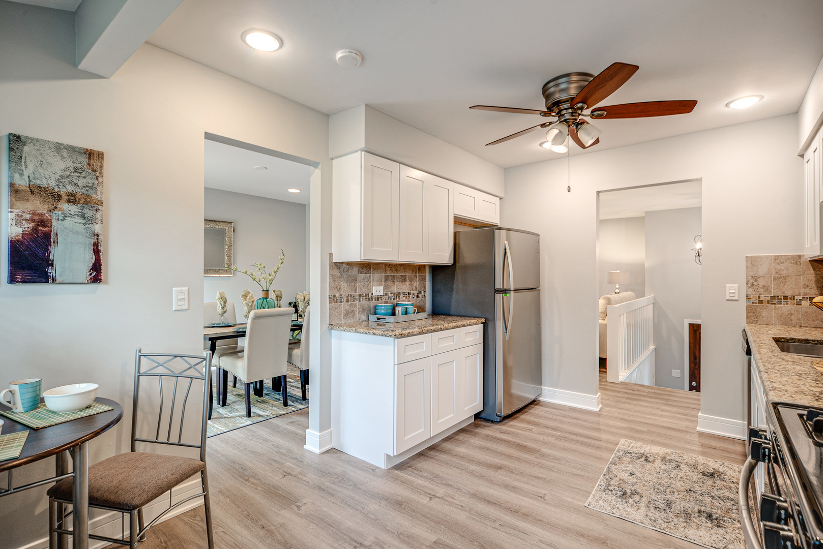 110 Haman Road Inverness, IL 60010 - Photo 7 of 30 a kitchen with stainless steel appliances a refrigerator and a dining table