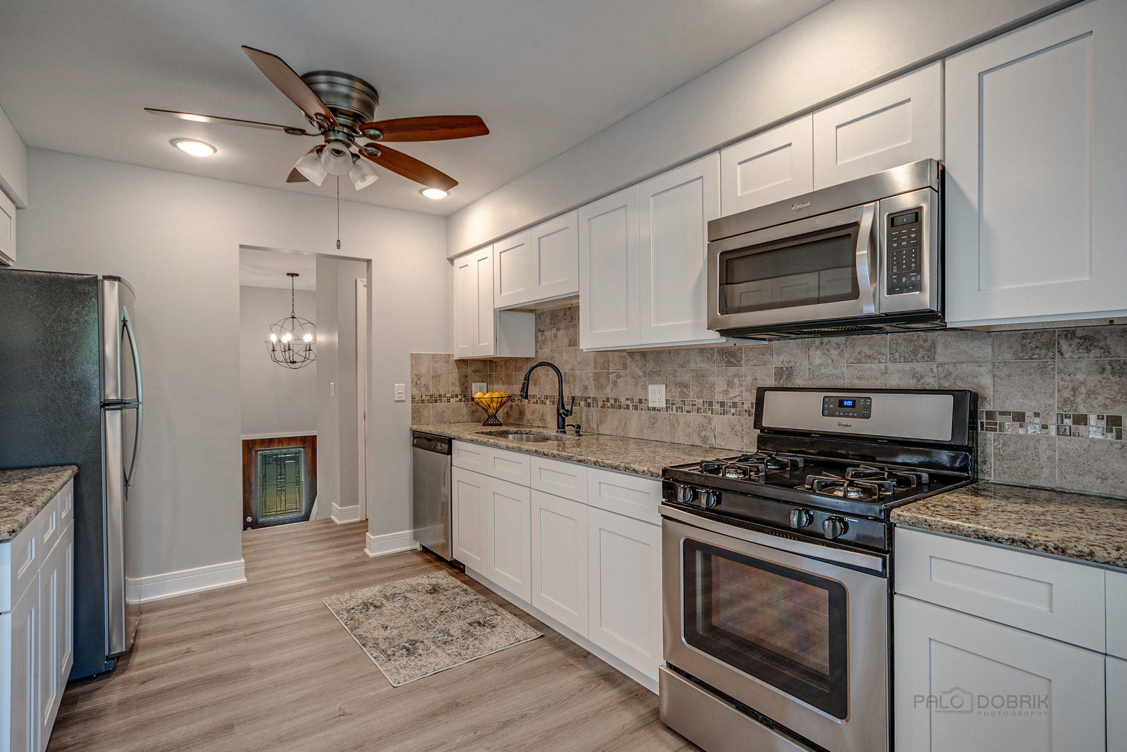 110 Haman Road Inverness, IL 60010 - Photo 10 of 30 a kitchen with stainless steel appliances granite countertop a stove microwave and refrigerator