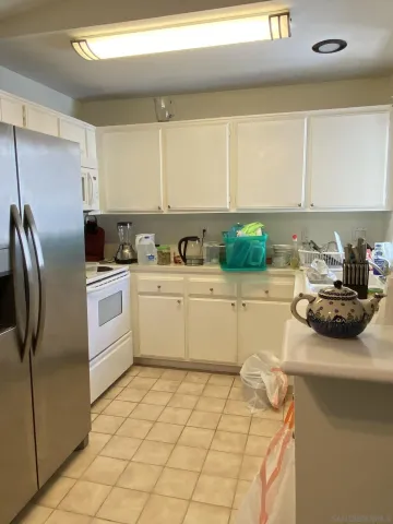 a room with furniture and a fan