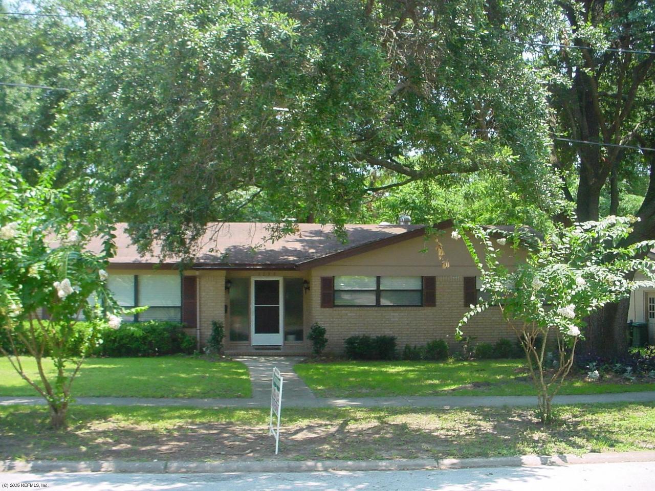 3733 Gurley Road Jacksonville, FL 32277 - Photo 3 of 6 a front view of a house with a garden