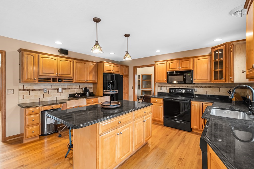 34 Schneider Road Somers, CT 06071 - Photo 11 of 42 a kitchen with stainless steel appliances granite countertop a sink stove and refrigerator