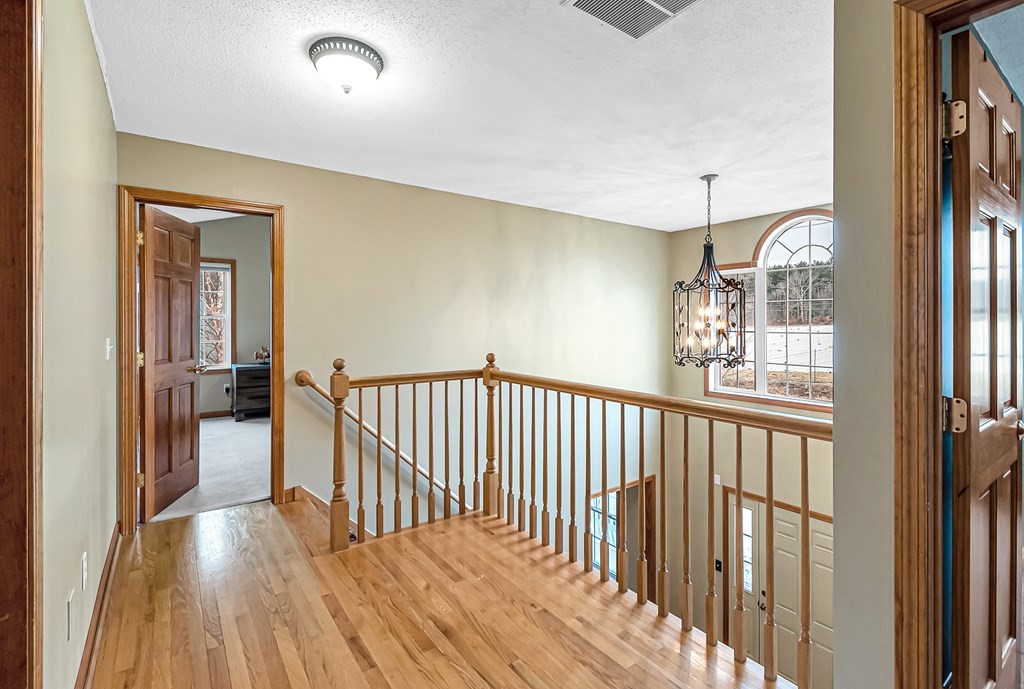 34 Schneider Road Somers, CT 06071 - Photo 18 of 42 a view of hallway with wooden floor
