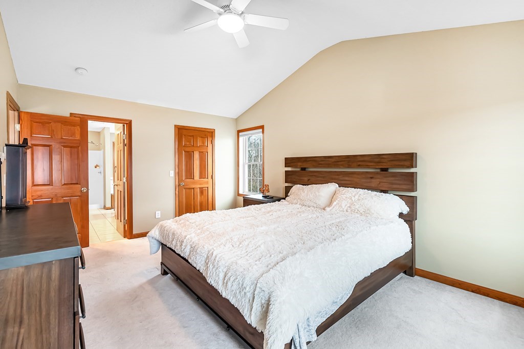 34 Schneider Road Somers, CT 06071 - Photo 20 of 42 a bedroom with a bed and large windows