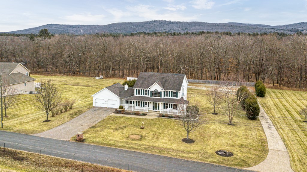 34 Schneider Road Somers, CT 06071 - Photo 2 of 42 a view of a lake with a mountain