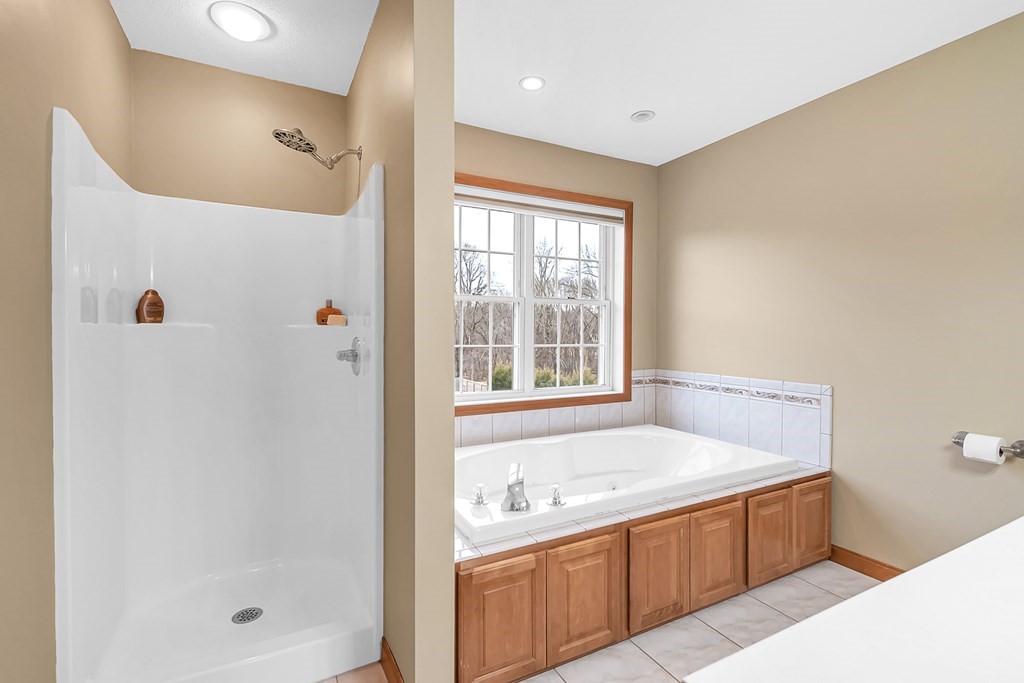 34 Schneider Road Somers, CT 06071 - Photo 23 of 42 a bathroom with a tub sink and mirror