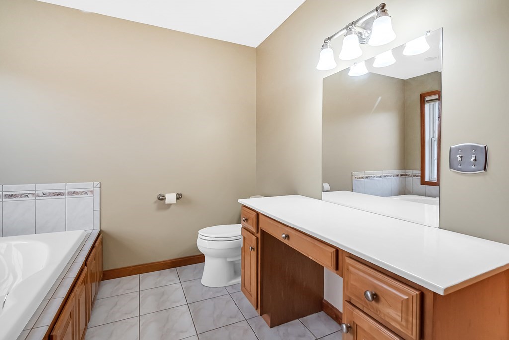 34 Schneider Road Somers, CT 06071 - Photo 24 of 42 a bathroom with a sink a toilet and vanity